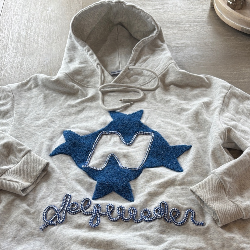 Aelfric Eden Cream Hoodie with Blue Appliqué
